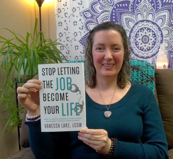 Vanessa holding her book for officers