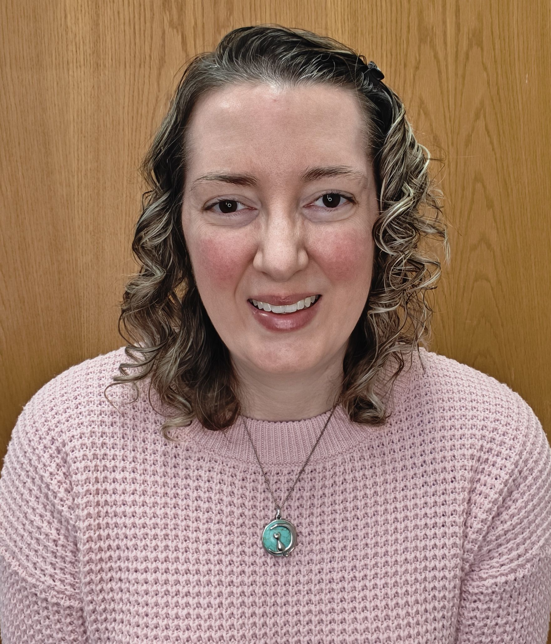 headshot vanessa lake in pink sweater